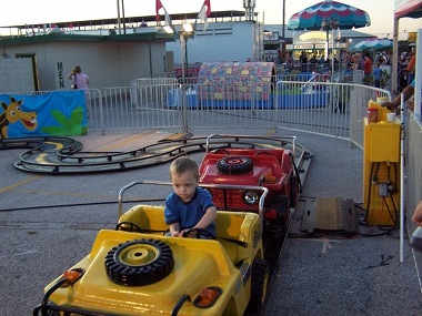 Vincent driving a Jeep at the Ozark Empire Fair